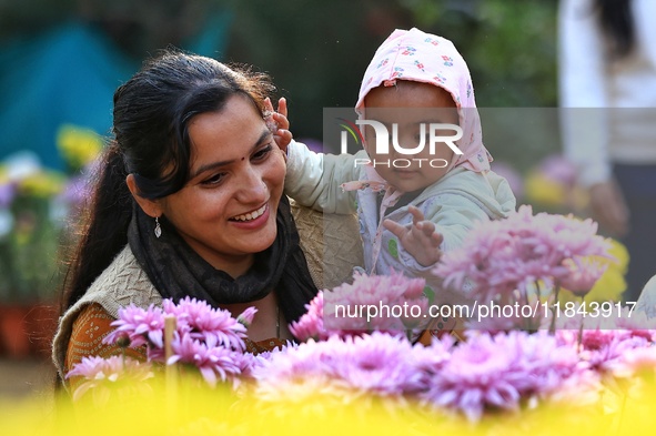 Visitors attend the 38th Chrysanthemum Flower Exhibition at Rajasthan University in Jaipur, Rajasthan, India, on December 7, 2024. 