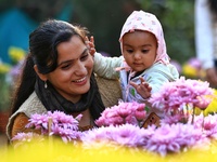 Visitors attend the 38th Chrysanthemum Flower Exhibition at Rajasthan University in Jaipur, Rajasthan, India, on December 7, 2024. (