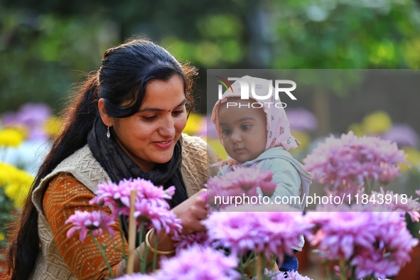 Visitors attend the 38th Chrysanthemum Flower Exhibition at Rajasthan University in Jaipur, Rajasthan, India, on December 7, 2024. 