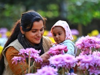 Visitors attend the 38th Chrysanthemum Flower Exhibition at Rajasthan University in Jaipur, Rajasthan, India, on December 7, 2024. (