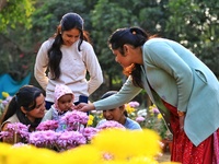 Visitors attend the 38th Chrysanthemum Flower Exhibition at Rajasthan University in Jaipur, Rajasthan, India, on December 7, 2024. (