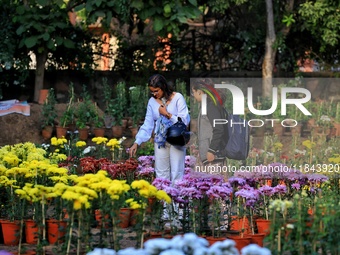 Visitors attend the 38th Chrysanthemum Flower Exhibition at Rajasthan University in Jaipur, Rajasthan, India, on December 7, 2024. (