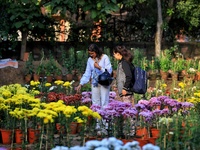 Visitors attend the 38th Chrysanthemum Flower Exhibition at Rajasthan University in Jaipur, Rajasthan, India, on December 7, 2024. (