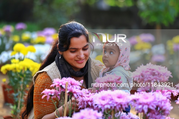 Visitors attend the 38th Chrysanthemum Flower Exhibition at Rajasthan University in Jaipur, Rajasthan, India, on December 7, 2024. 