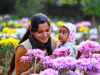 Visitors attend the 38th Chrysanthemum Flower Exhibition at Rajasthan University in Jaipur, Rajasthan, India, on December 7, 2024. (