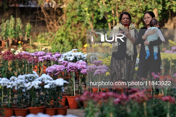 Visitors attend the 38th Chrysanthemum Flower Exhibition at Rajasthan University in Jaipur, Rajasthan, India, on December 7, 2024. 