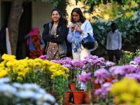 Visitors attend the 38th Chrysanthemum Flower Exhibition at Rajasthan University in Jaipur, Rajasthan, India, on December 7, 2024. (