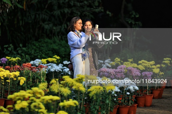 Visitors attend the 38th Chrysanthemum Flower Exhibition at Rajasthan University in Jaipur, Rajasthan, India, on December 7, 2024. 