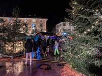 Umbrellas adorn the festive scene in Starnberg, Bavaria, Germany, on December 7, 2024, as the Christmas market embraces the charm of a rainy...