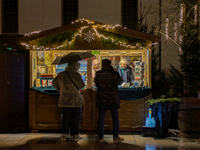 Umbrellas adorn the festive scene in Starnberg, Bavaria, Germany, on December 7, 2024, as the Christmas market embraces the charm of a rainy...