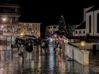 Umbrellas adorn the festive scene in Starnberg, Bavaria, Germany, on December 7, 2024, as the Christmas market embraces the charm of a rainy...