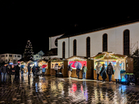 Umbrellas adorn the festive scene in Starnberg, Bavaria, Germany, on December 7, 2024, as the Christmas market embraces the charm of a rainy...