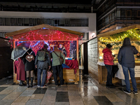 Umbrellas adorn the festive scene in Starnberg, Bavaria, Germany, on December 7, 2024, as the Christmas market embraces the charm of a rainy...