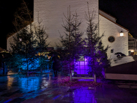 Umbrellas adorn the festive scene in Starnberg, Bavaria, Germany, on December 7, 2024, as the Christmas market embraces the charm of a rainy...