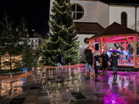 Umbrellas adorn the festive scene in Starnberg, Bavaria, Germany, on December 7, 2024, as the Christmas market embraces the charm of a rainy...