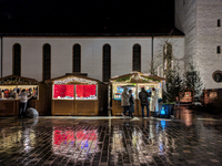 Umbrellas adorn the festive scene in Starnberg, Bavaria, Germany, on December 7, 2024, as the Christmas market embraces the charm of a rainy...