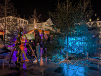 Umbrellas adorn the festive scene in Starnberg, Bavaria, Germany, on December 7, 2024, as the Christmas market embraces the charm of a rainy...