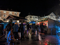 Umbrellas adorn the festive scene in Starnberg, Bavaria, Germany, on December 7, 2024, as the Christmas market embraces the charm of a rainy...