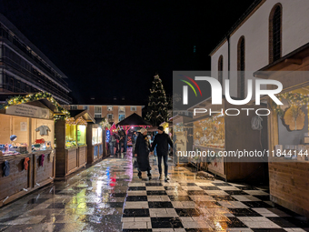 Umbrellas adorn the festive scene in Starnberg, Bavaria, Germany, on December 7, 2024, as the Christmas market embraces the charm of a rainy...