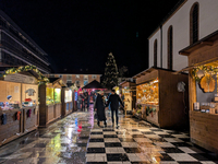 Umbrellas adorn the festive scene in Starnberg, Bavaria, Germany, on December 7, 2024, as the Christmas market embraces the charm of a rainy...