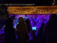 Umbrellas adorn the festive scene in Starnberg, Bavaria, Germany, on December 7, 2024, as the Christmas market embraces the charm of a rainy...