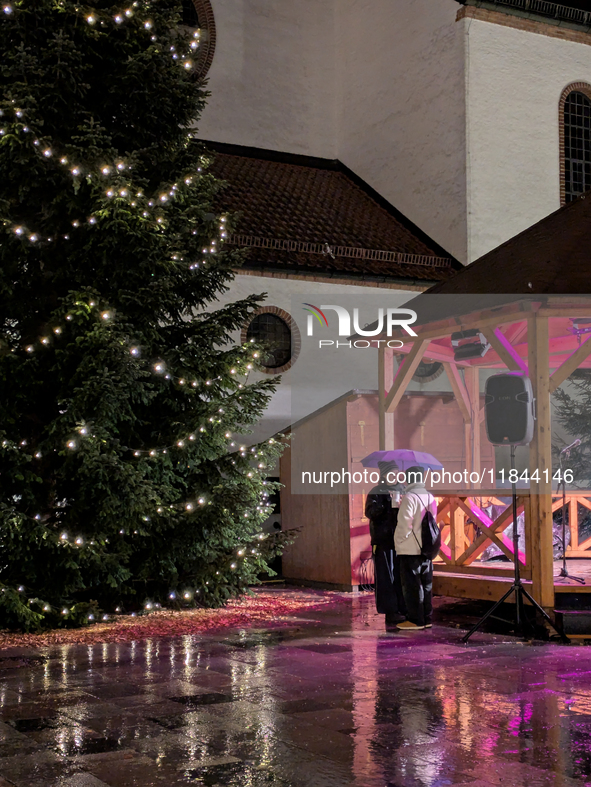 Umbrellas adorn the festive scene in Starnberg, Bavaria, Germany, on December 7, 2024, as the Christmas market embraces the charm of a rainy...