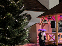 Umbrellas adorn the festive scene in Starnberg, Bavaria, Germany, on December 7, 2024, as the Christmas market embraces the charm of a rainy...