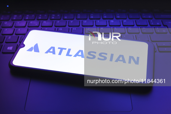 The Atlassian Corporation logo appears on the screen of a smartphone in Reno, United States, on December 7, 2024. 