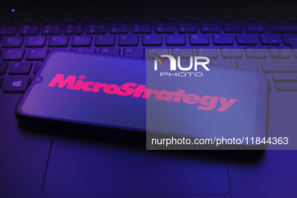 The MicroStrategy Incorporated logo appears on the screen of a smartphone in Reno, United States, on December 7, 2024. 