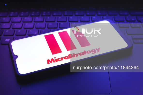 The MicroStrategy Incorporated logo appears on the screen of a smartphone in Reno, United States, on December 7, 2024. 