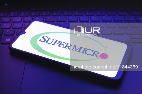 The Super Micro Computer, Inc. (Supermicro) logo appears on the screen of a smartphone in Reno, United States, on December 7, 2024. 