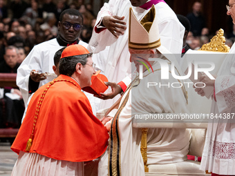 Canadian new Cardinal Frank Leo receives his biretta as he is appointed cardinal by Pope Francis during a consistory ceremony in the Saint P...