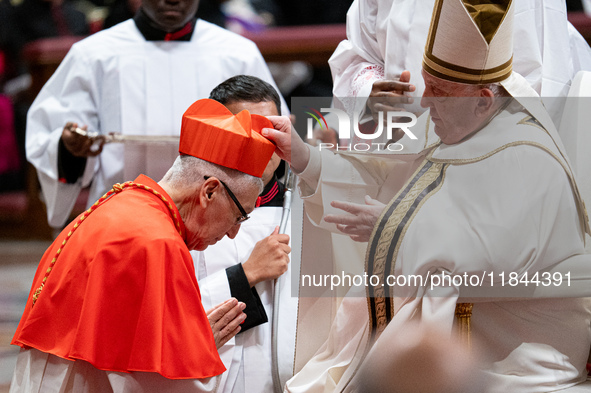 Peruvian Cardinal Carlos Gustavo Castillo Mattasoglio receives his biretta as he is appointed cardinal by Pope Francis during a consistory c...