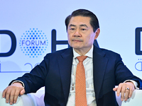 Henry Huiyao Wang, Founder and President of the Center for China and Globalization, takes part in a panel discussion during the Doha Forum 2...