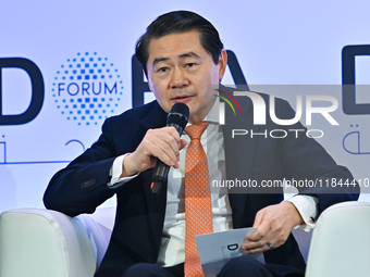 Henry Huiyao Wang, Founder and President of the Center for China and Globalization, takes part in a panel discussion during the Doha Forum 2...