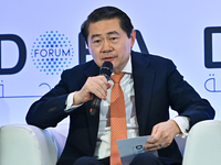 Henry Huiyao Wang, Founder and President of the Center for China and Globalization, takes part in a panel discussion during the Doha Forum 2...