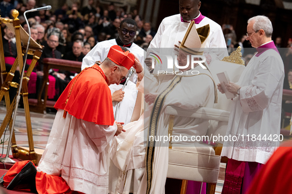 Italian Cardinal Baldassare Reina receives his biretta as he is appointed cardinal by Pope Francis during a consistory ceremony in the Saint...