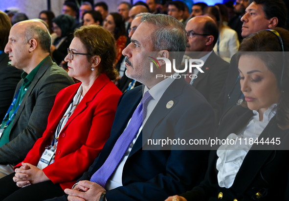 Turkish Foreign Minister Hakan Fidan (2-R) attends the Doha Forum 2024 at Sheraton Grand Doha Resort & Convention Hotel ahead of the 22nd ed...