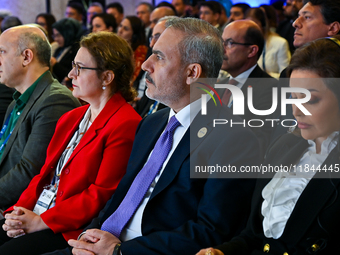 Turkish Foreign Minister Hakan Fidan (2-R) attends the Doha Forum 2024 at Sheraton Grand Doha Resort & Convention Hotel ahead of the 22nd ed...