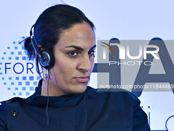 Imane Khelif, a professional boxer from Algeria, takes part in a panel discussion during the Doha Forum 2024 at Sheraton Grand Doha Resort &...