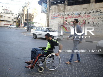 Image of Fadi Al-Deeb, 31 years old, in front of his house in Gaza City, on April 6, 2016. Fadi he is unemployed - and he studied IT. He is...