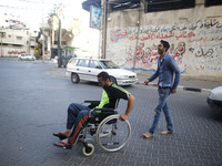 Image of Fadi Al-Deeb, 31 years old, in front of his house in Gaza City, on April 6, 2016. Fadi he is unemployed - and he studied IT. He is...