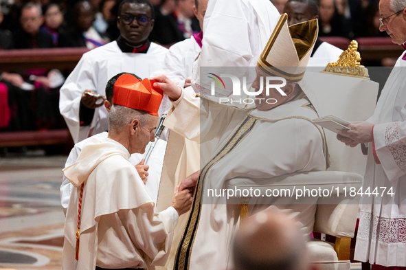 Newly-appointed Franco-Algerian Cardinal Jean-Paul Vesco (L) looks on during an Ordinary Public Consistory for the creation of new cardinals...