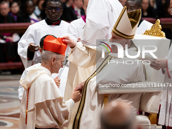 Newly-appointed Franco-Algerian Cardinal Jean-Paul Vesco (L) looks on during an Ordinary Public Consistory for the creation of new cardinals...