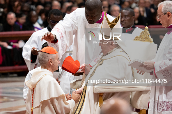 Newly-appointed Franco-Algerian Cardinal Jean-Paul Vesco (L) looks on during an Ordinary Public Consistory for the creation of new cardinals...