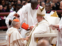 Newly-appointed Franco-Algerian Cardinal Jean-Paul Vesco (L) looks on during an Ordinary Public Consistory for the creation of new cardinals...