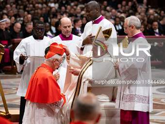 Pope Francis places the biretta upon the head of newly appointed Argentina cardinal Vicente Bokalic Iglic during an Ordinary Public Consisto...