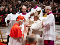 Pope Francis places the biretta upon the head of newly appointed Argentina cardinal Vicente Bokalic Iglic during an Ordinary Public Consisto...