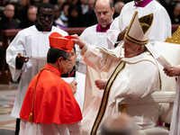 Pope Francis places the biretta upon the head of newly appointed Equatorian Cardinal Luis Gerardo Cabrera Herrera during an Ordinary Public...