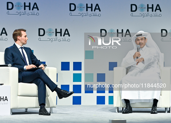 Qatar's Energy Minister and CEO of QatarEnergy, Saad Sherida al-Kaabi (R), speaks during the Doha Forum 2024 at Sheraton Grand Doha Resort &...